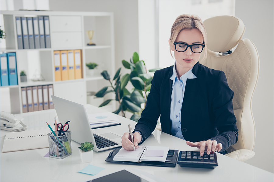 female accountant checking fee block documents
