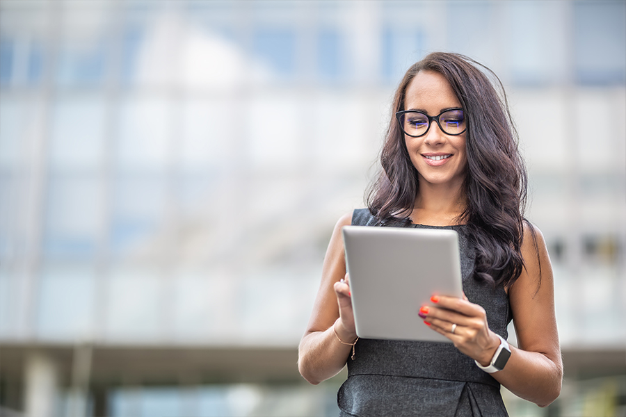 happy business owner looking at VAT finance on laptop